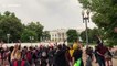 Black Lives Matter protesters wave to White House snipers