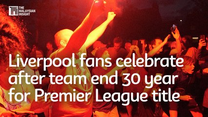 Liverpool fans celebrate after team end 30 year for Premier League title