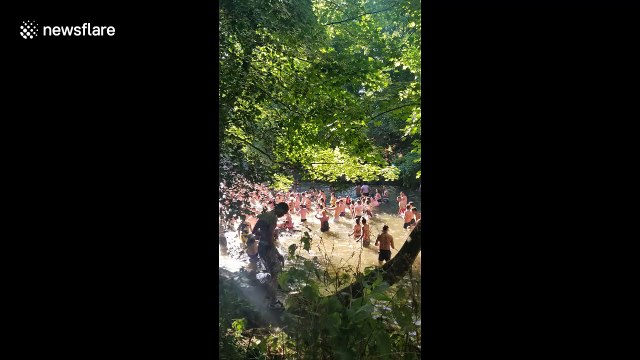 Hackney Marshes overcrowded with people cooling off on hottest day of the year