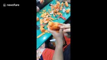 Vietnamese man impressively uses carrots to sculpt an old man fishing