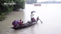 Deadly floods hit north-east India forcing villagers to shelter