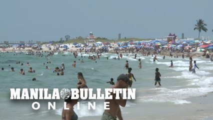 Florida residents head to the beach despite virus surge