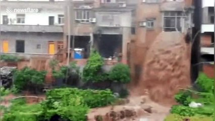 Floodwater pours from second-floor flat like a waterfall after rainstorm in southern China