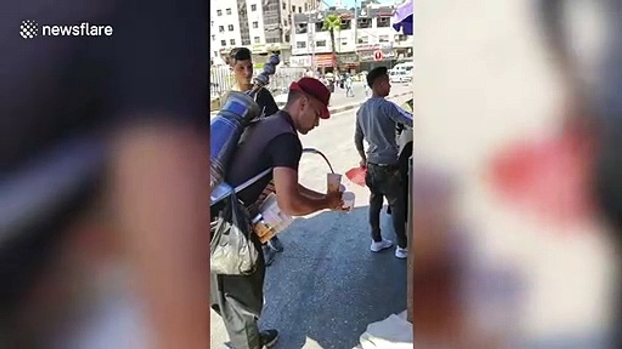Street vendor makes awesome coffee waterfall