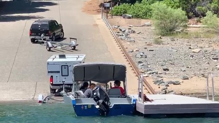Driver Struggles to Drive With Boat Trailer Attached to Car's Back