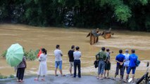 Floods wreak havoc in parts of China, India