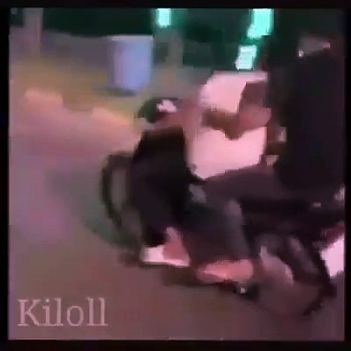 2 young men racing motorcycles