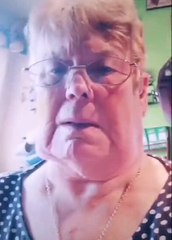 Grandmother Is Confused Looking At Herself On Camera With Face Filter