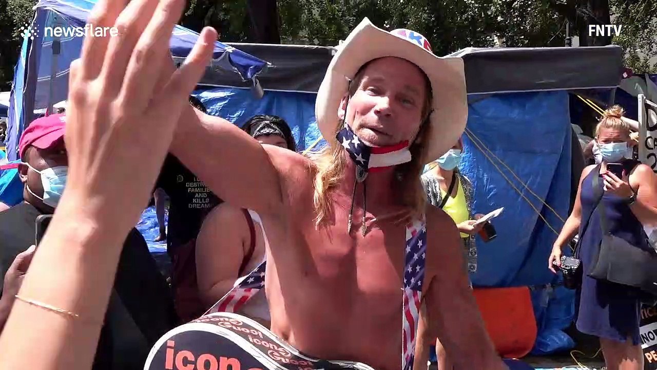 World-famous New York street performer 'Naked Cowboy' told to leave City Hall protest