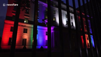 Pride flag made out of colorful floodlights illuminates building in Toronto