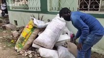 Bengal monitor lizard stuck under pile of rubbish rescued in southern India