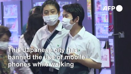 Japanese city bans mobile phone use while walking