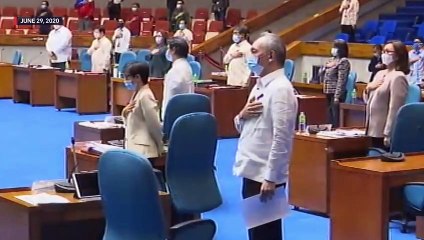 Caught on video, Remulla sorry for writing note during ‘Lupang Hinirang’