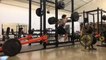 Man Fails to do Squats With Barbell Due to Unbalanced Weights