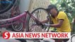 Vietnam News | Hanoi man breathes new life into old bicycles for poor children