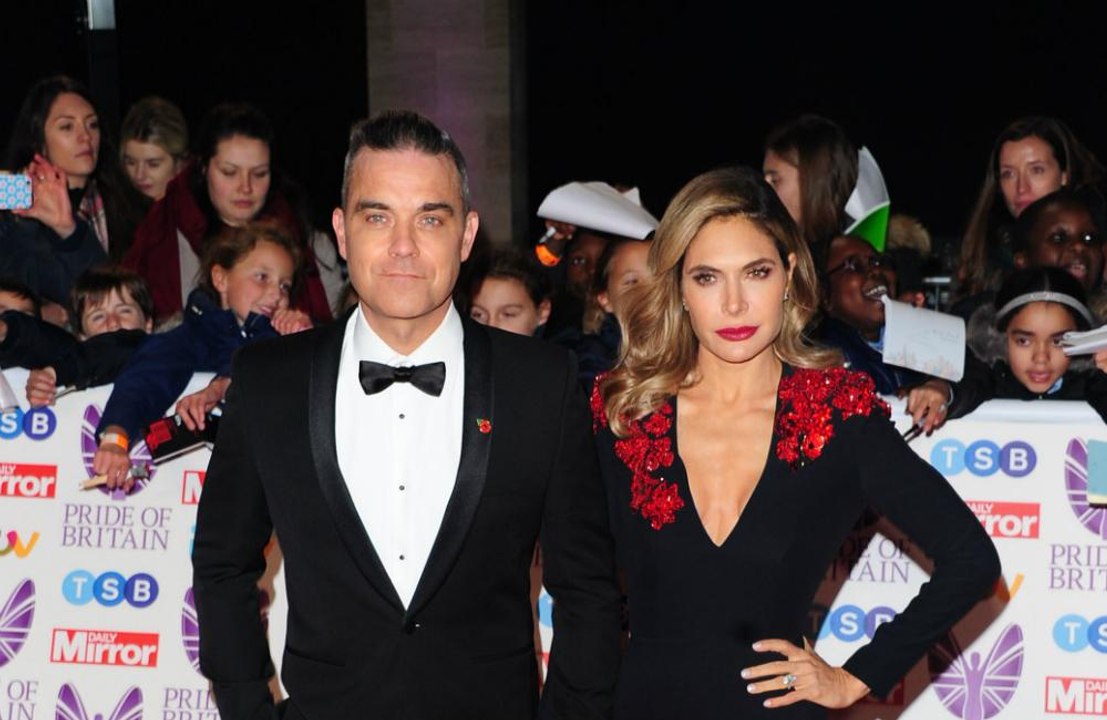 Robbie Williams and Ayda Field threatened with...