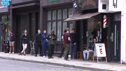 People queue for haircuts as lockdown is eased in England