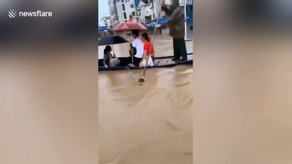 Chinese county suspends university entrance exam due to flash flooding