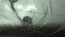 Giant hail smashes windshield during tornado-warned storm