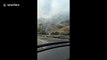 Firefighters battle flames in Simi Valley, California mountains