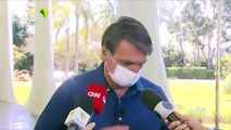 Brazil's Bolsonaro removes face mask after testing positive for virus