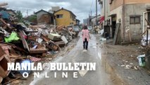 Destruction and debris on streets after deadly floods in Japan