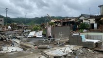 Streets littered with debris after deadly flooding