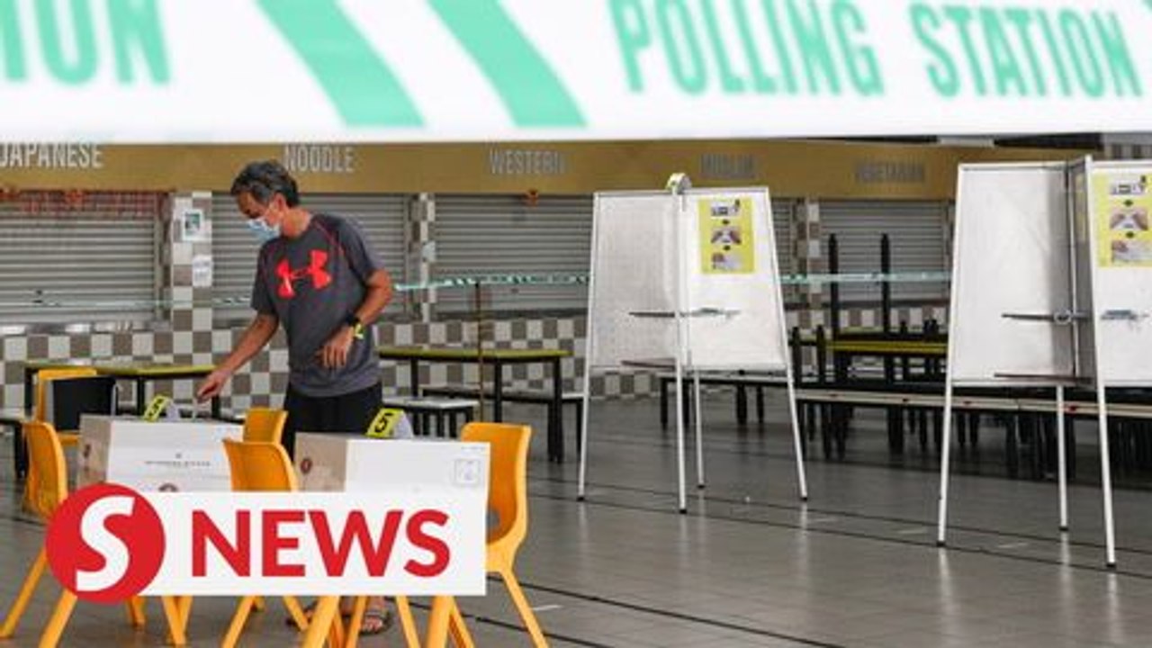 In masks and gloves, Singaporeans vote under COVID-19 cloud