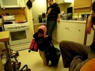 Toting around a number of bags (hatted)