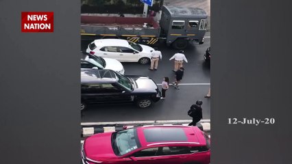 प्रेमिका को पति के साथ देखकर महिला कार के बोनट पर चढ़ी, बीच सड़क पर काटा बवाल