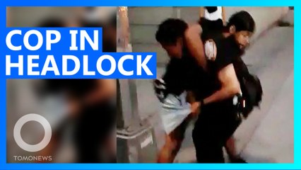 NYPD Cop Put in Headlock While Trying to Disperse Crowd