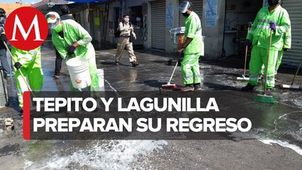Comerciantes de Tepito y la Lagunilla limpian banquetas para reapertura de negocios
