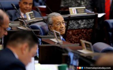 Dr M decides to sit down after attack from ruling MPs
