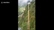 Adrenaline junkie takes on Vietnam's highest wooden suspension bridge