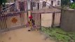 Chinese fireman dives into floodwater to open gate to evacuate stranded residents