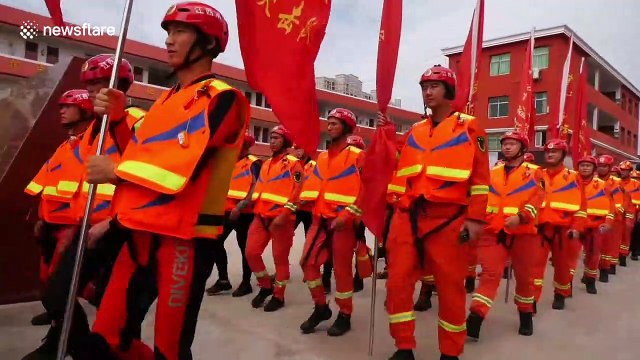 Firefighters rescue 2,000 stranded people after burst dam floods village