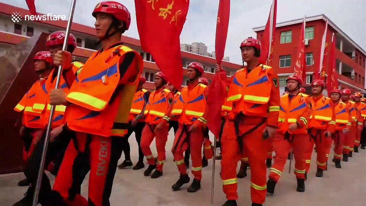 Firefighters rescue 2,000 stranded people after burst dam floods village