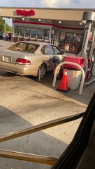 Woman Has Inefficient Way to Get Gas