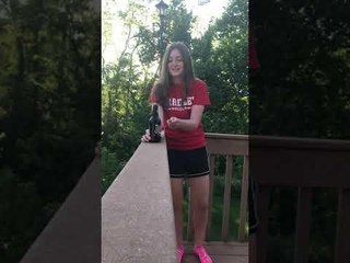 Girl Removes Beer Bottle Cap by Tapping it With Butter Knife