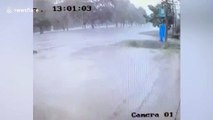 Car spins out of control on wet road and hits utility pole in Thailand