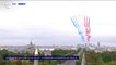 14-Juillet: la patrouille de France dessine son emblématique panache de fumée bleu-blanc-rouge au-dessus des Champs-Élysées