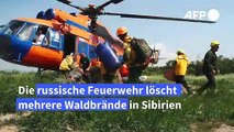 Feuerwehr löscht schwer zu erreichende Waldbrände in Sibirien