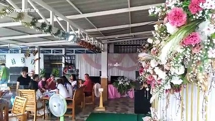 Eccentric lottery winner throws money and gold from flying paramotor