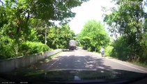 Speed Hump Nearly Sends Cyclist Under Truck