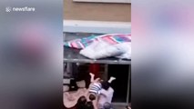 Chinese man catches toddler falling from fourth floor of residential building