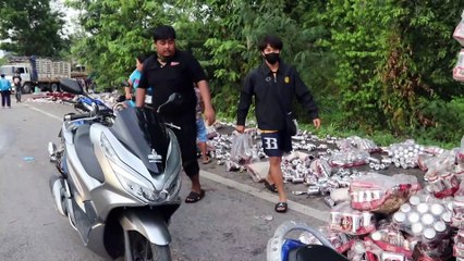 Truck Spills Hundreds Of Cans Of Beer