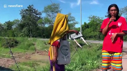 Mother and frightened daughter emerge from car wreckage after being hit by pickup truck in Thailand