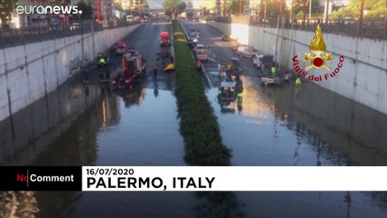 Dozens swim to safety after floods trap cars in Palermo underpass