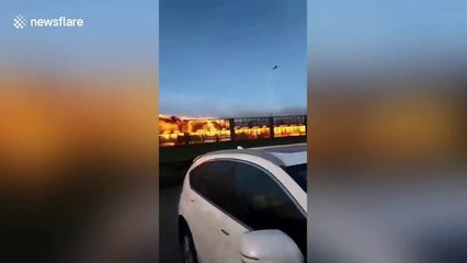 Chinese driver risks life to move burning truck away from petrol station