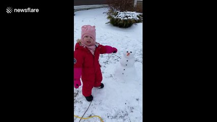 Frostbite: Little girl in Canada takes a chomp out of snowman's nose
